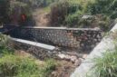 Foto: proyek pemasangan batu pada anak sungai di Desa Cangkreng. 