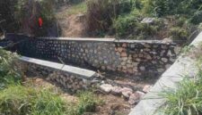 Foto: proyek pemasangan batu pada anak sungai di Desa Cangkreng. 