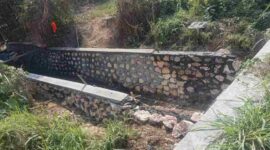 Foto: proyek pemasangan batu pada anak sungai di Desa Cangkreng. 